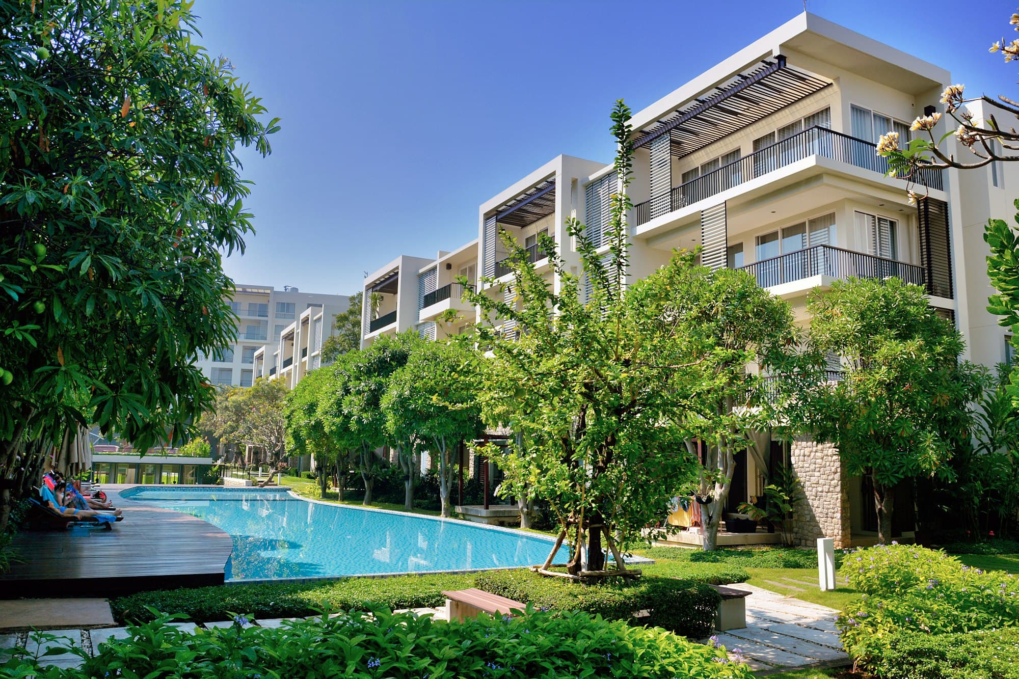 Apartment community with a pool and landscaping