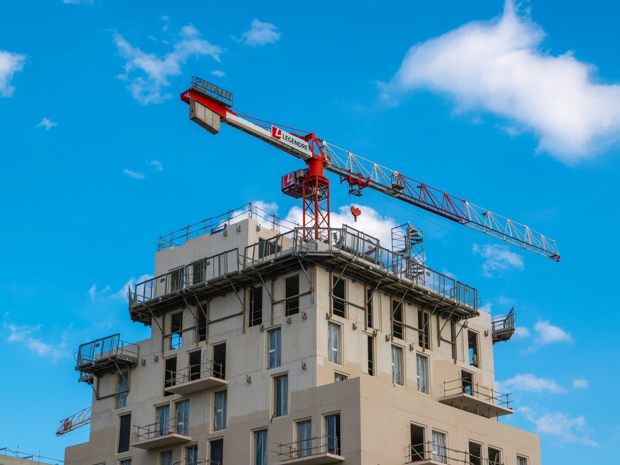 Tower crane above a building under construction