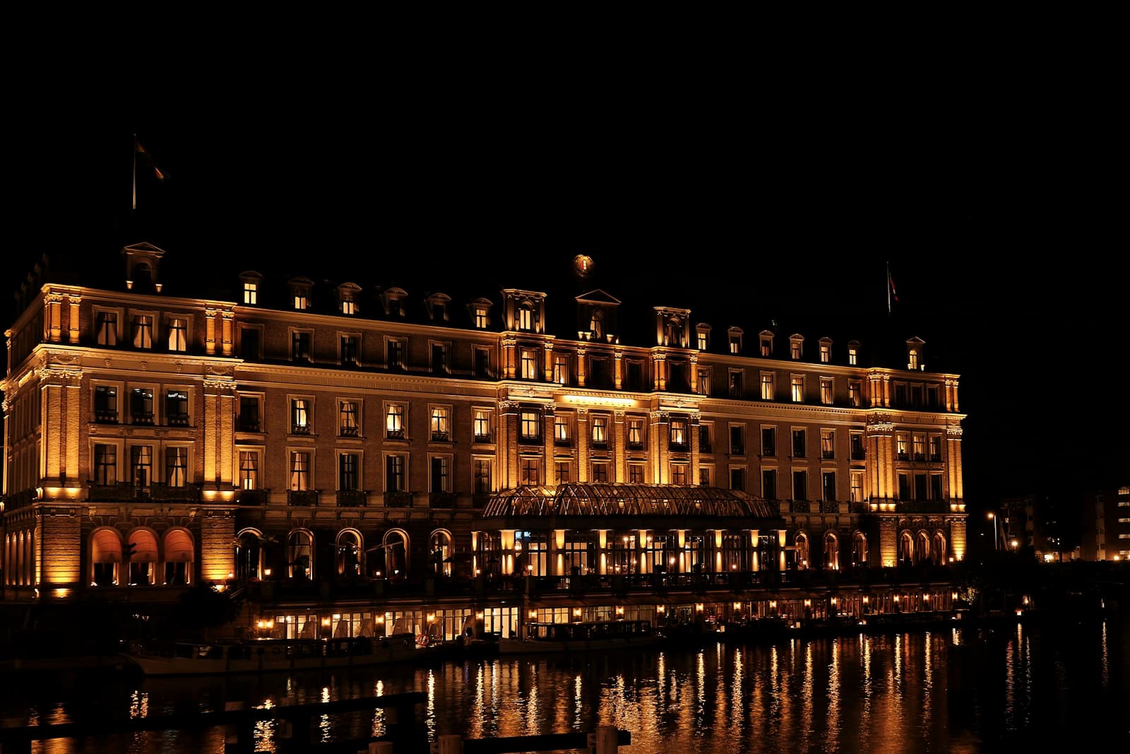 Waterfront hotel lit up at night